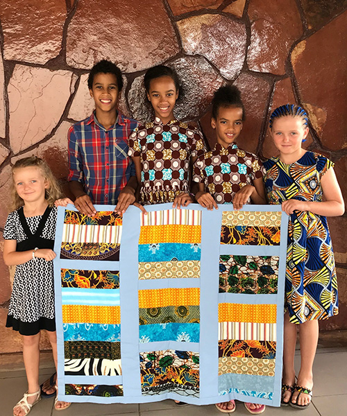 At retreat, missioner kids make a quilt and learn about service
