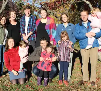 Participating families of a recent event pose for a group photo outside of Maryknoll during the Autumn.