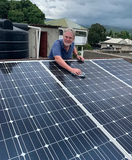Mike cleaning solar panels