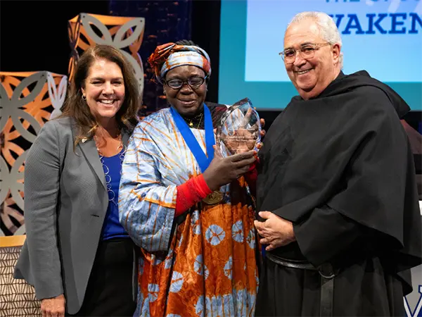 Dr. Margaret Itto holds Opus Prize for Bishop Taban