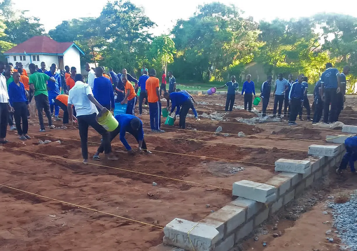 students build basketball court