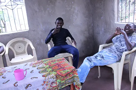 Emmanuel and Isaiah inside new home